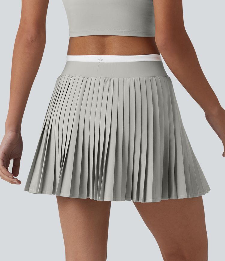 Jupe mini de tennis plissée 2-en-1 Breezeful™ color block taille haute à séchage rapide avec poches