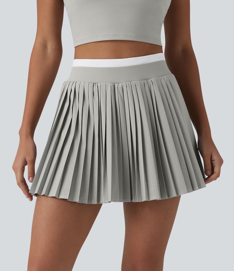 Jupe mini de tennis plissée 2-en-1 Breezeful™ color block taille haute à séchage rapide avec poches