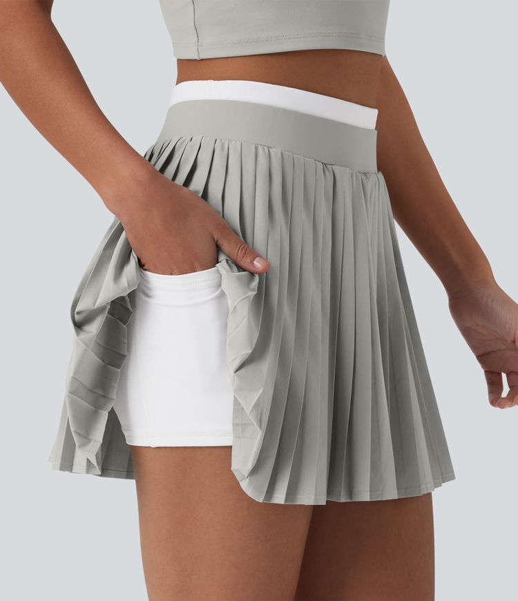 Jupe mini de tennis plissée 2-en-1 Breezeful™ color block taille haute à séchage rapide avec poches