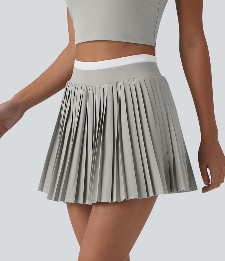 Jupe mini de tennis plissée 2-en-1 Breezeful™ color block taille haute à séchage rapide avec poches