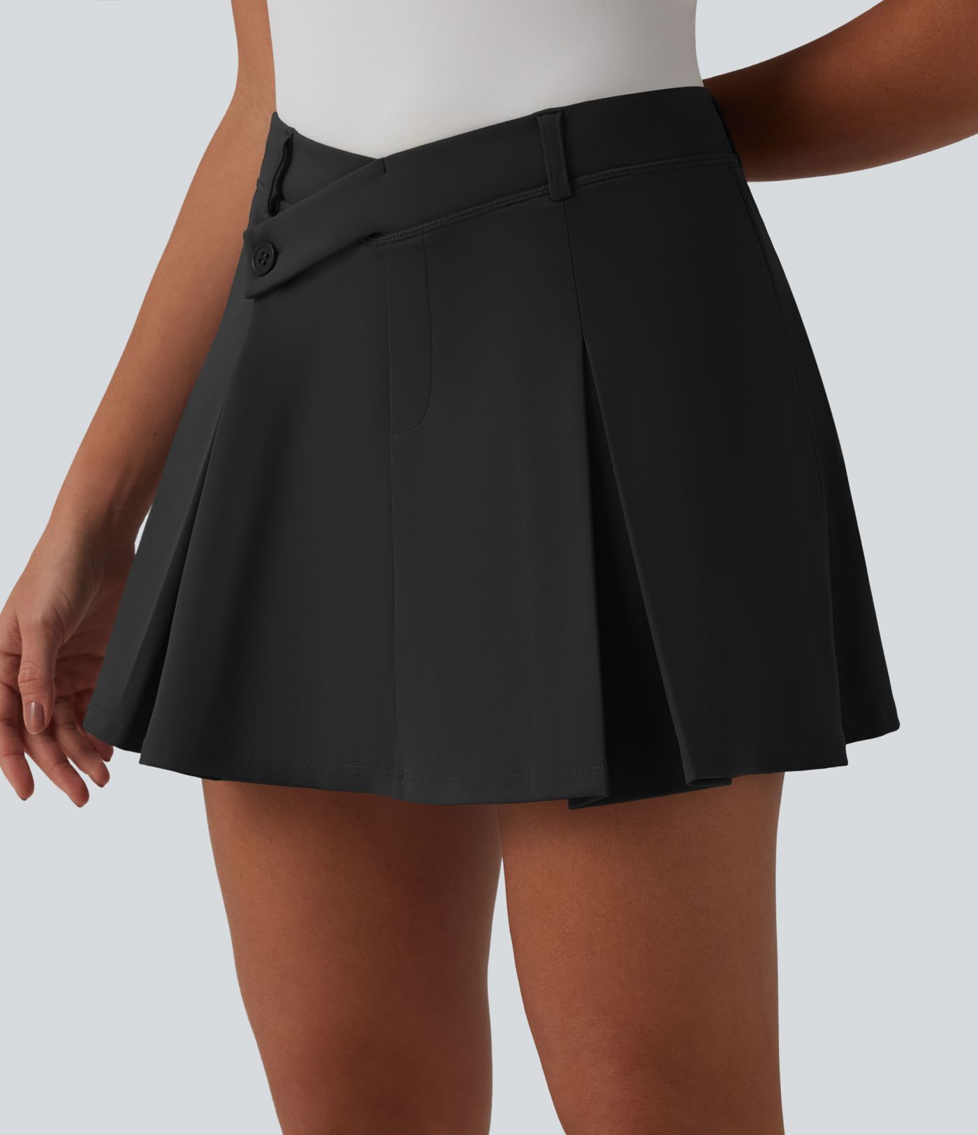 DayStretch Asymmetric Mid Rise 2-in-1 Pleated Mini Golf Skirt with Pockets