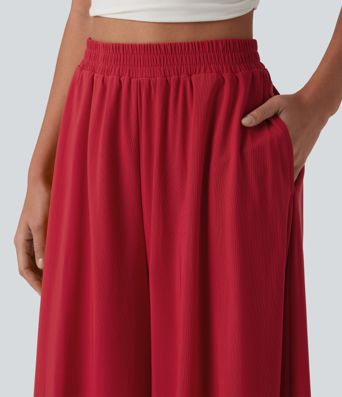 Pantalon fluide et ample avec superposition en mesh, poches latérales et taille haute