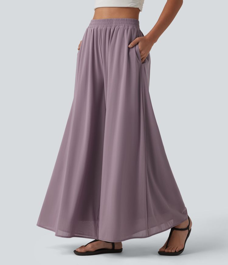 Pantalon fluide et ample avec superposition en mesh, poches latérales et taille haute