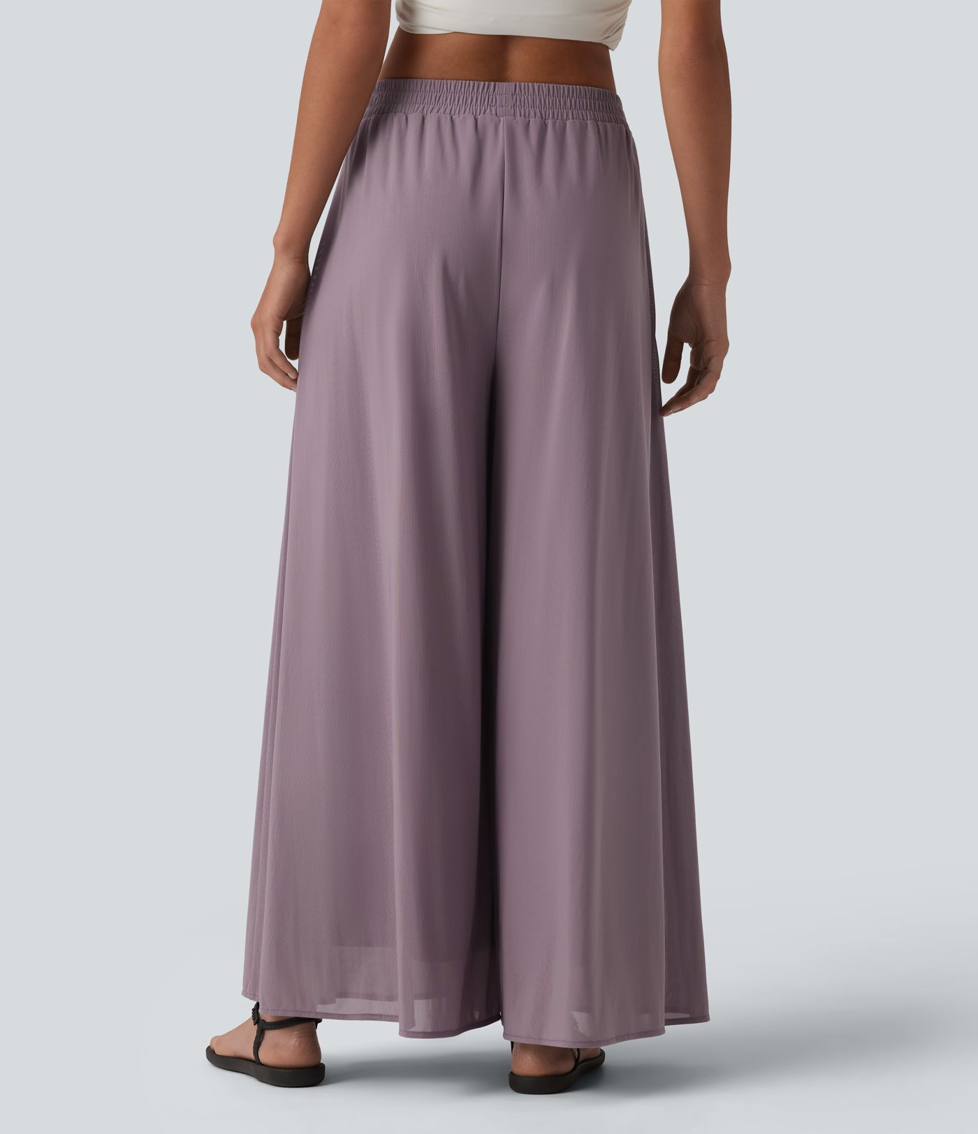 Pantalon fluide et ample avec superposition en mesh, poches latérales et taille haute