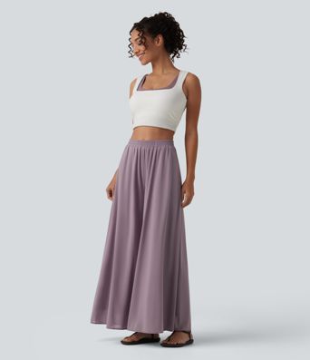 Pantalon fluide et ample avec superposition en mesh, poches latérales et taille haute