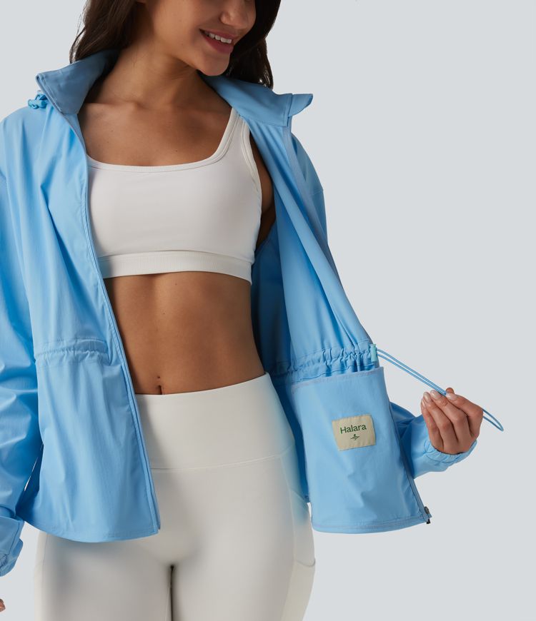 Veste de sport déperlante à capuche amovible avec cordon de serrage et poches zippées