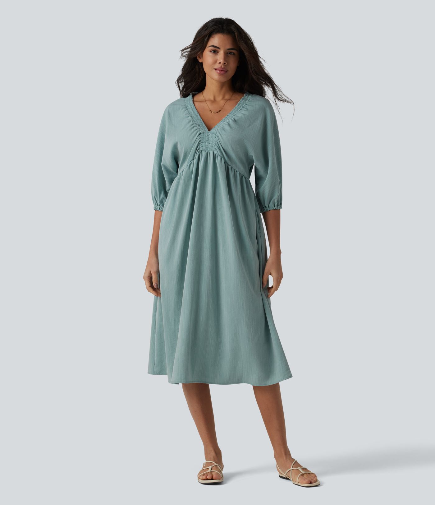 Robe mi-longue décontractée à col en V et manches 3/4, effet lin, avec poches.