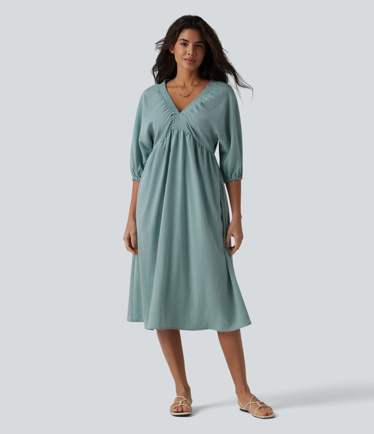 Robe mi-longue décontractée à col en V et manches 3/4, effet lin, avec poches.