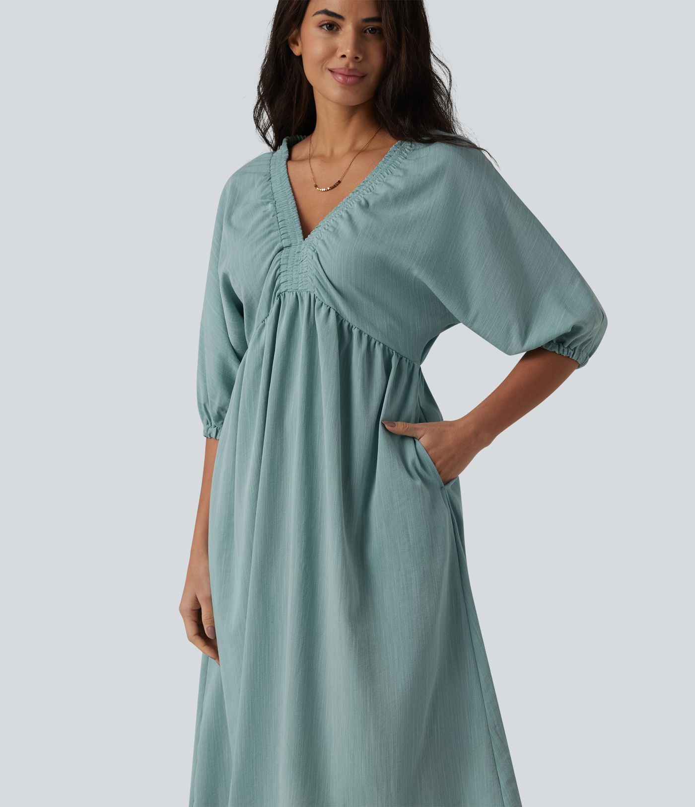 Robe mi-longue décontractée à col en V et manches 3/4, effet lin, avec poches.