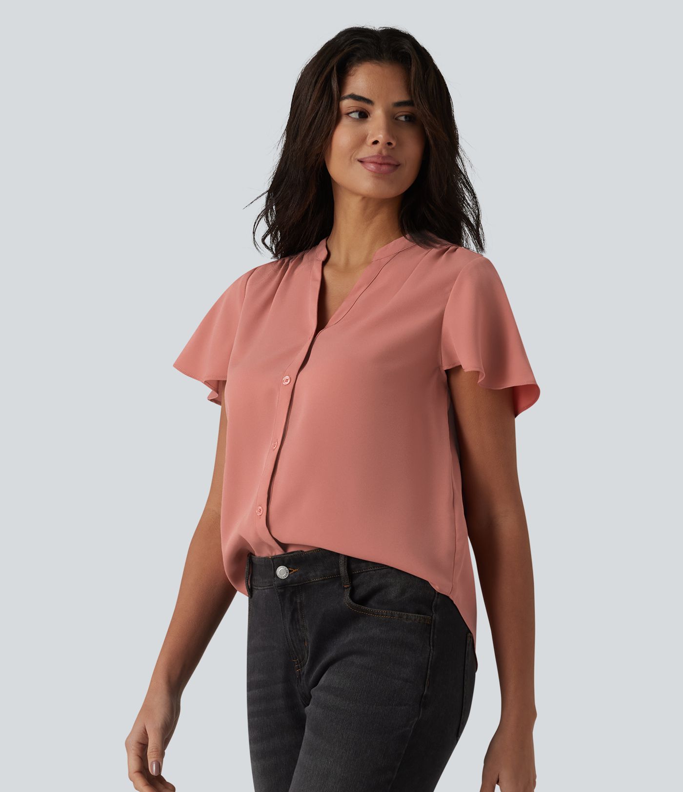 Casual blouse with a V-neck, flounced sleeves and a rounded hem.