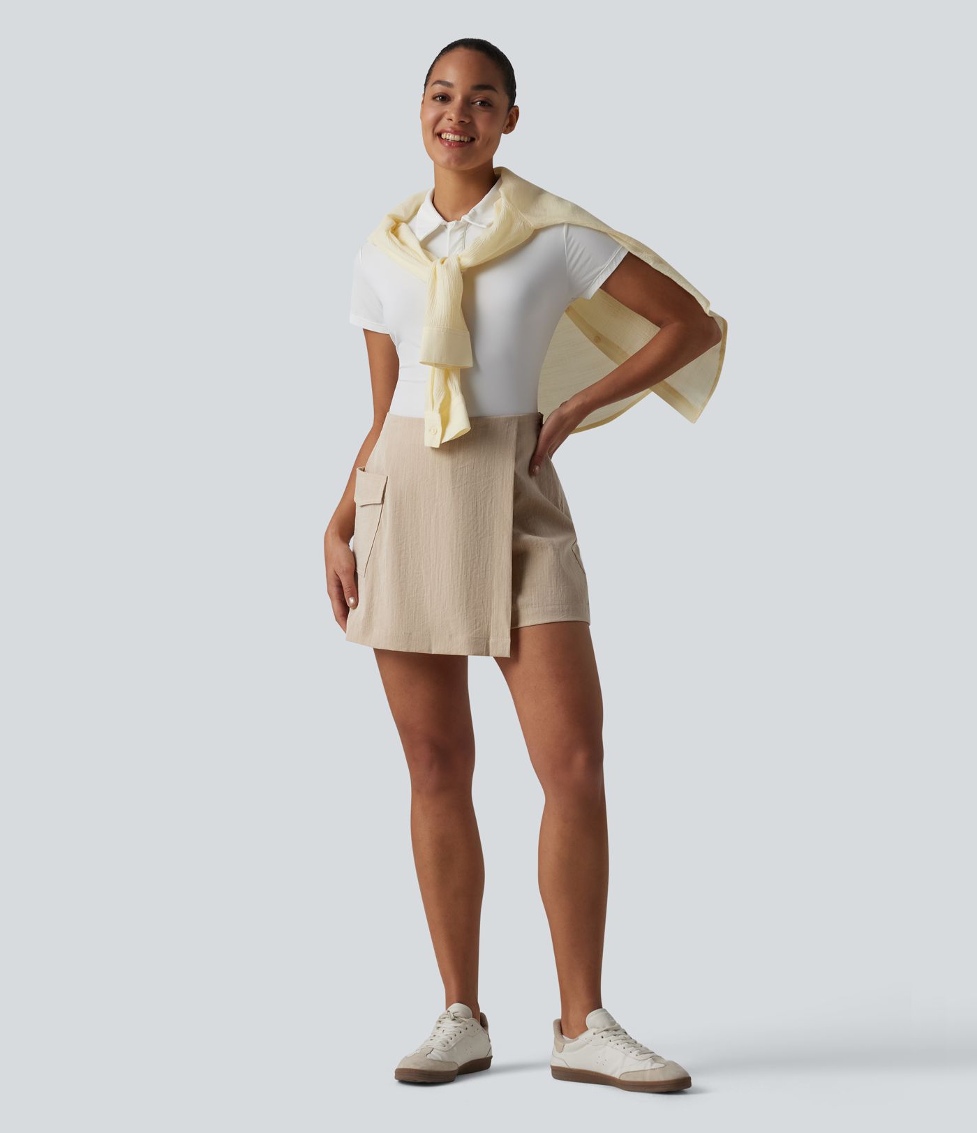 Neformální sukňové šortky (skort) s vysokým pasem, skrytým zipem, lněným vzhledem a kapsou