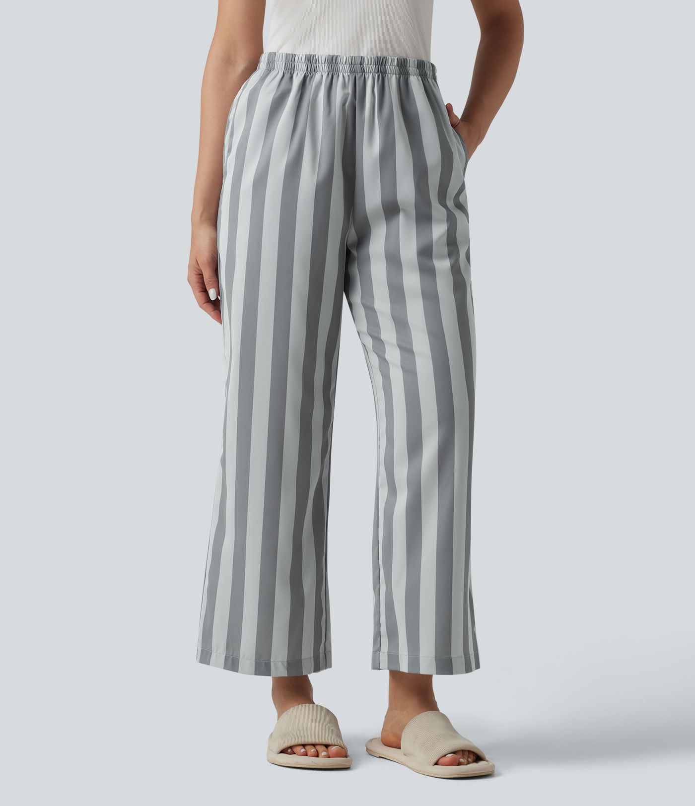 Pantalones lounge a rayas de talle alto y pernera recta con bolsillos