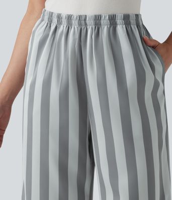 Pantalones lounge a rayas de talle alto y pernera recta con bolsillos