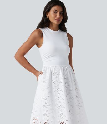 Ärmelloses Midikleid mit Rundhalsausschnitt, Seitentaschen und Lochstickerei Ärmelloses Midikleid mit Rundhalsausschnitt, Seitentaschen und Lochstickerei