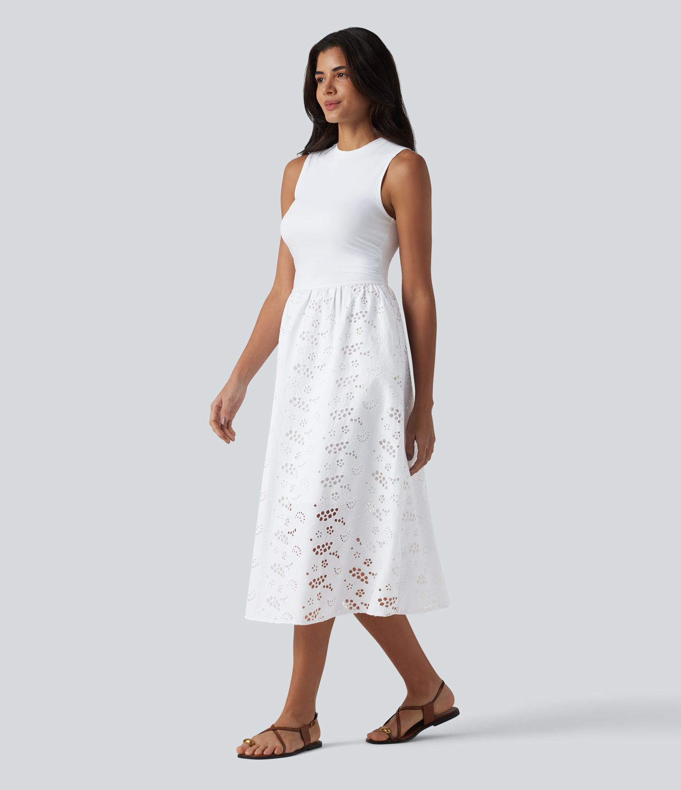 Ärmelloses Midikleid mit Rundhalsausschnitt, Seitentaschen und Lochstickerei Ärmelloses Midikleid mit Rundhalsausschnitt, Seitentaschen und Lochstickerei