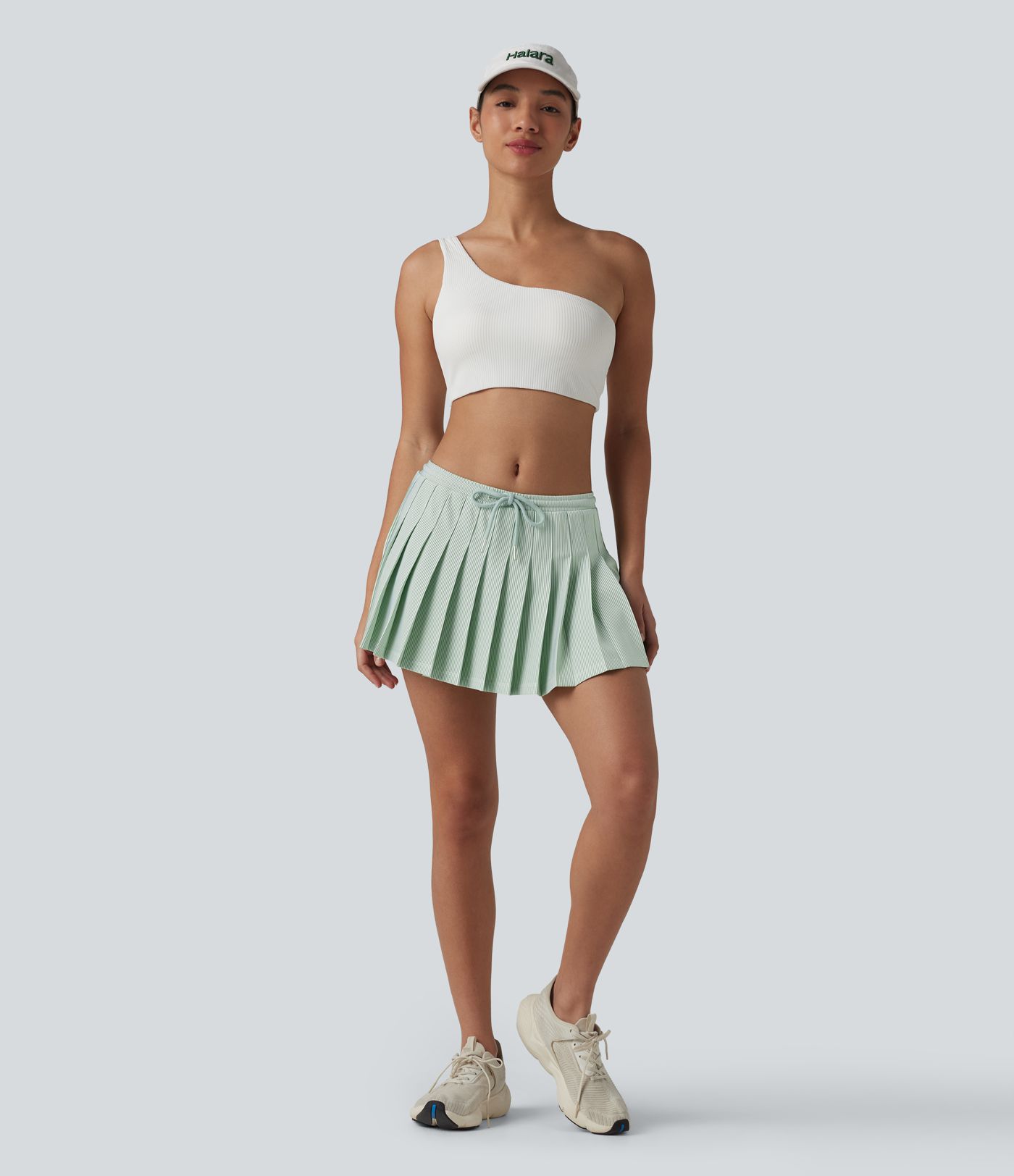 Jupe mini plissée 2-en-1 de padel/pickleball taille basse à rayures, cordon de serrage et poches