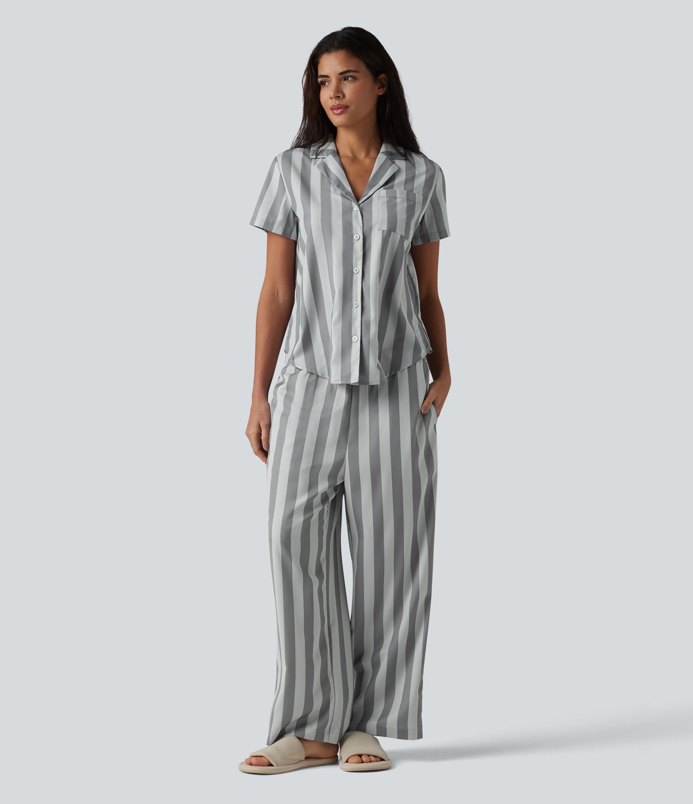 Pantalones lounge a rayas de talle alto y pernera recta con bolsillos