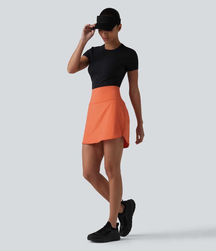 Jupe de golf courte 2-en-1 SoftlyZero™ Airy toucher frais taille ultra haute ventre plat avec ourlet arrondi et poches