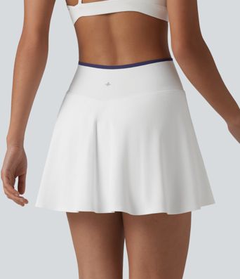 Jupe de tennis mini 2-en-1 color block croisée taille mi-haute avec poches
