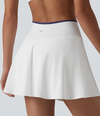 Jupe de tennis mini 2-en-1 color block croisée taille mi-haute avec poches
