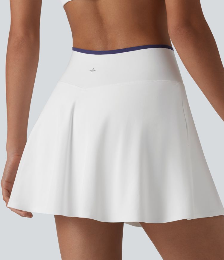 Jupe de tennis mini 2-en-1 color block croisée taille mi-haute avec poches