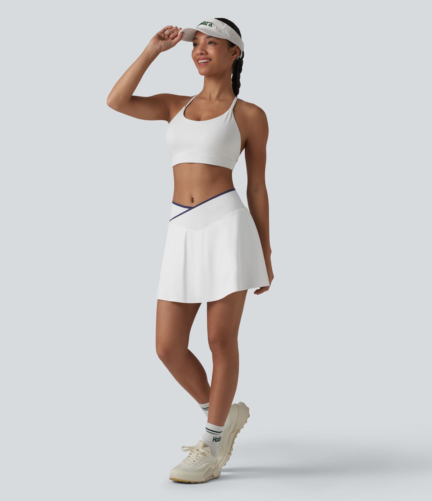 Jupe de tennis mini 2-en-1 color block croisée taille mi-haute avec poches