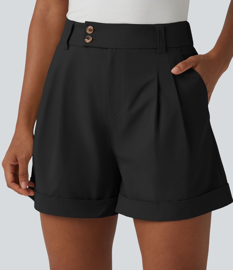 Pleated baggy office shorts made of elastic poplin with a high waist, side pockets and a folded-over waistband.