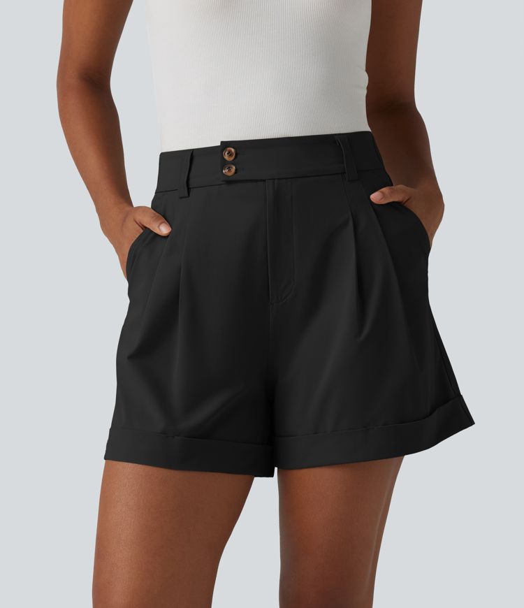 Pleated baggy office shorts made of elastic poplin with a high waist, side pockets and a folded-over waistband.
