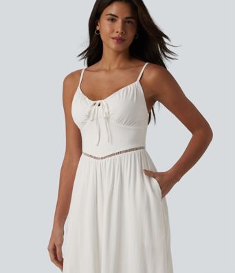 Önü bağlamalı, dekolteli, cepli, keten görünümlü midi askılı elbise.