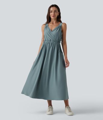 Robe casual midi sans manches à col en V avec poches Robe casual midi sans manches à col en V avec poches