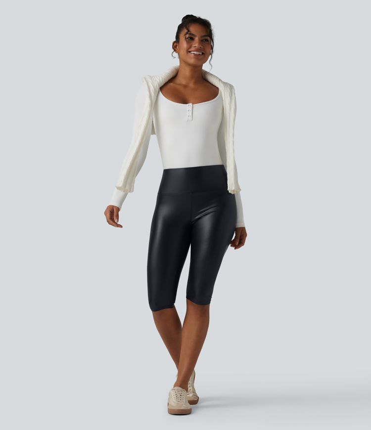 Casual high-waisted stretch cropped leggings in faux leather with pockets, designed to flatten the tummy and provide a flattering fit.