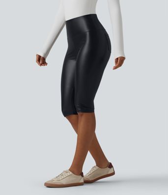 Casual high-waisted stretch cropped leggings in faux leather with pockets, designed to flatten the tummy and provide a flattering fit.