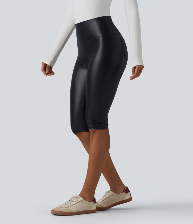 Casual high-waisted stretch cropped leggings in faux leather with pockets, designed to flatten the tummy and provide a flattering fit.
