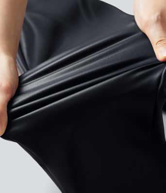 Casual high-waisted stretch cropped leggings in faux leather with pockets, designed to flatten the tummy and provide a flattering fit.