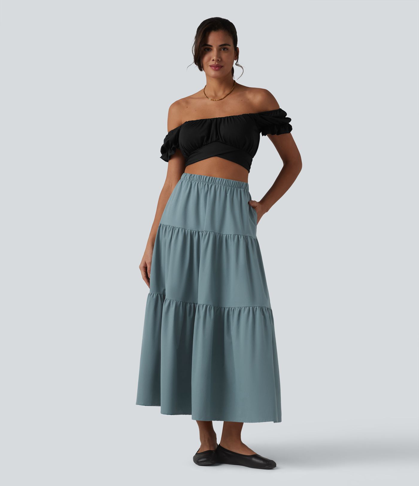 Casual A-line midi skirt made of stretchy poplin with a high waist and side pockets