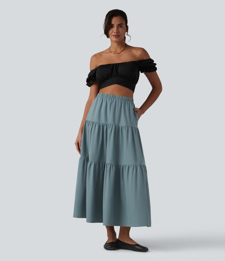 Casual A-line midi skirt made of stretchy poplin with a high waist and side pockets
