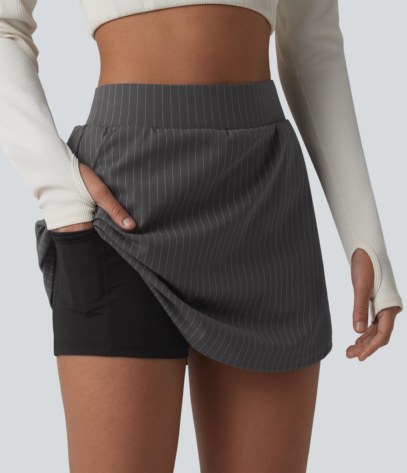 2-in-1 sports mini skirt with mid-rise waist and multiple pockets