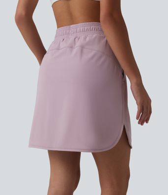 Jupe mini sport 2 en 1 Softlyzero™ Airy : taille mi-haute, poches latérales, cordon de serrage, tissu frais au toucher et ourlet arrondi.
