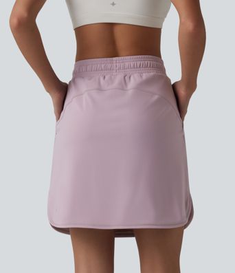 Jupe mini sport 2 en 1 Softlyzero™ Airy : taille mi-haute, poches latérales, cordon de serrage, tissu frais au toucher et ourlet arrondi.