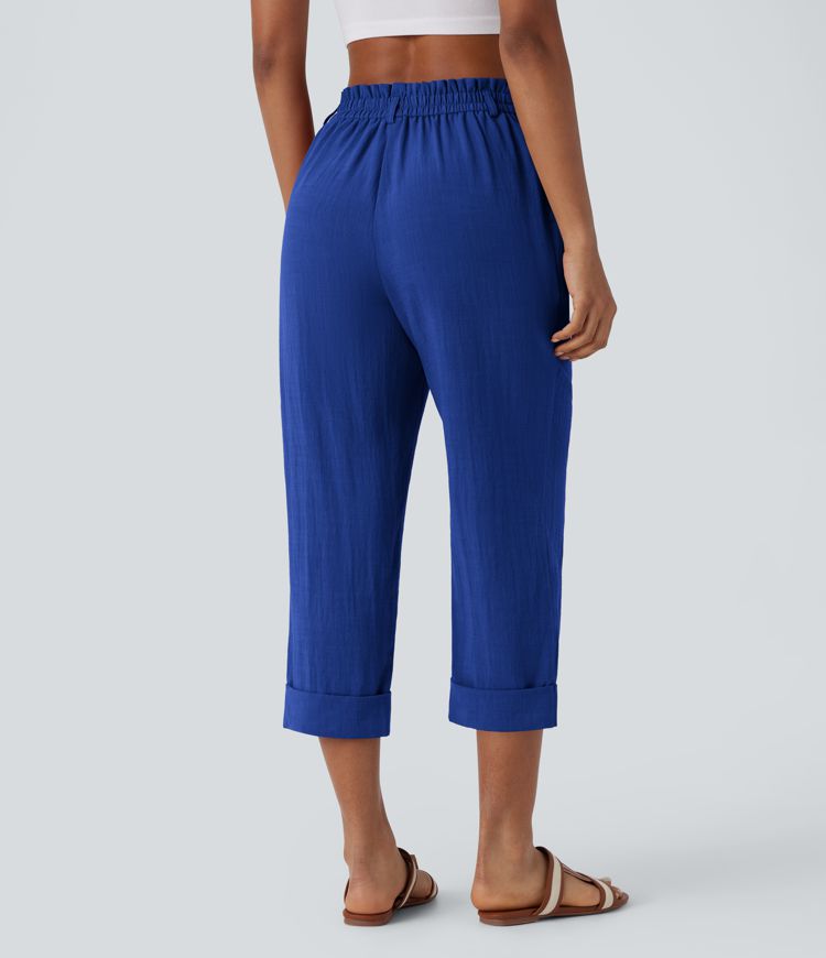 Pantalón capri lino tiro alto bolsillo lateral cremallera botón