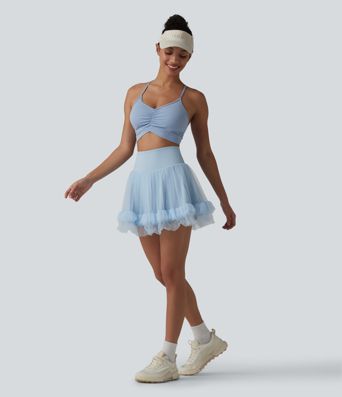 Hochtaillierter, figurformender 2-in-1-Minirock aus kontrastierendem Mesh mit Taschen