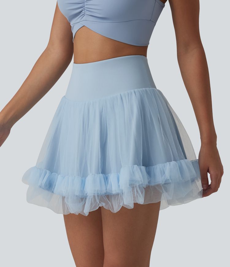 Hochtaillierter, figurformender 2-in-1-Minirock aus kontrastierendem Mesh mit Taschen