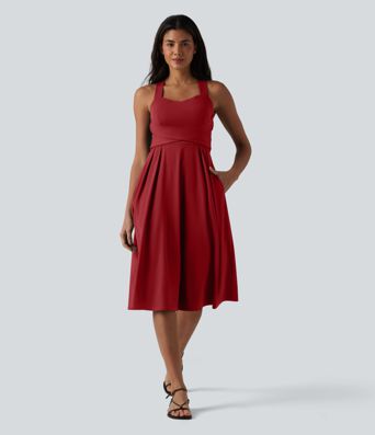 Robe midi fluide sans manches décolleté cœur avec bretelles croisées, nœud dans le dos et poches