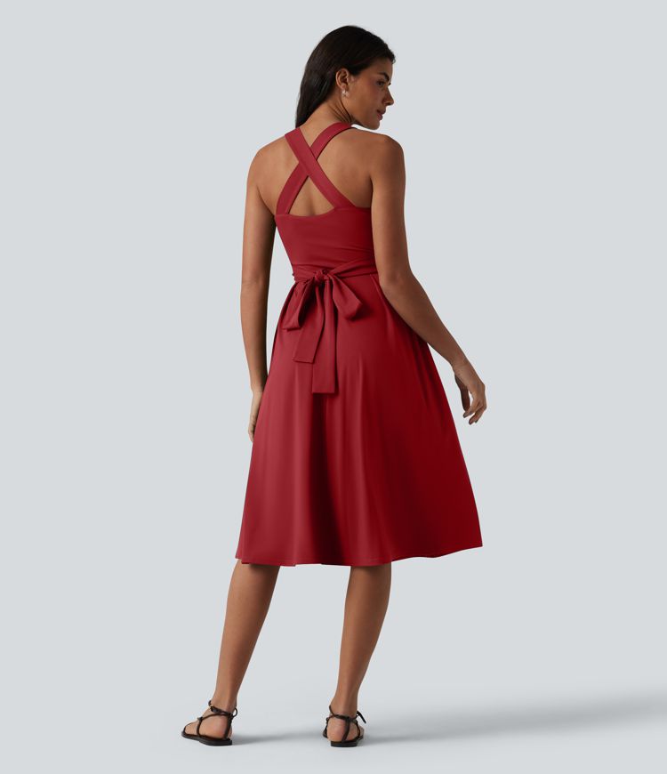 Robe midi fluide sans manches décolleté cœur avec bretelles croisées, nœud dans le dos et poches