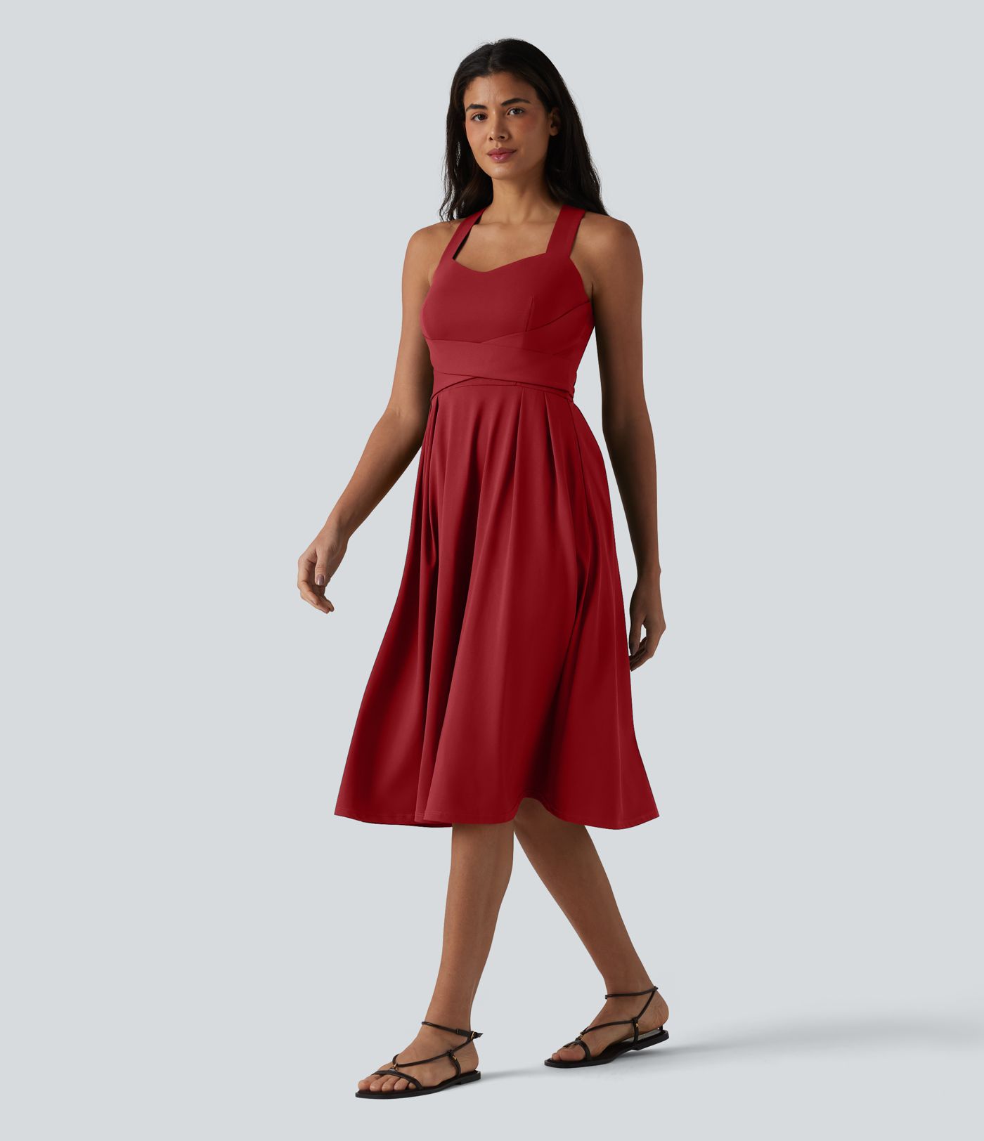 Robe midi fluide sans manches décolleté cœur avec bretelles croisées, nœud dans le dos et poches