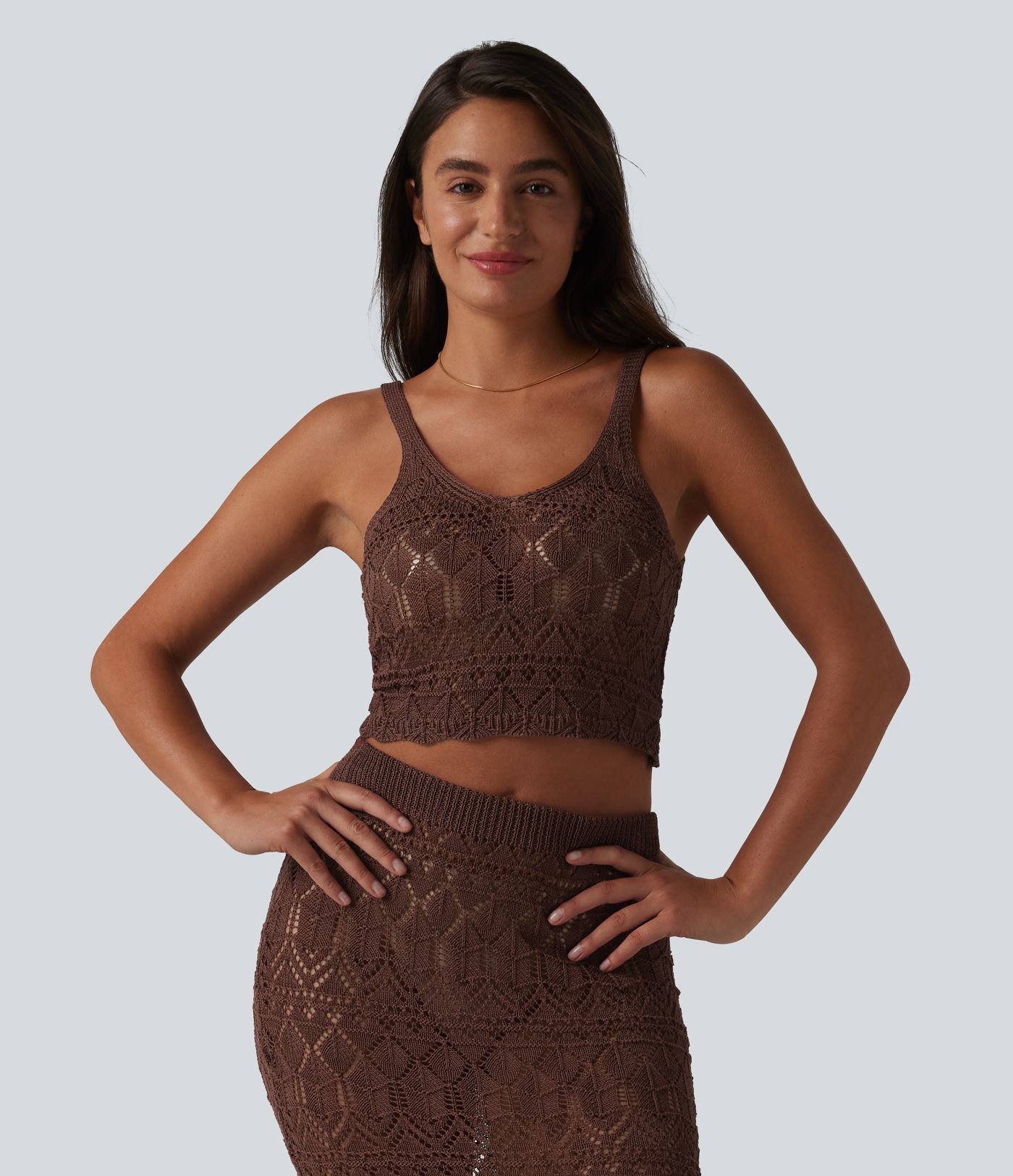 Top corto sin mangas de punto calado