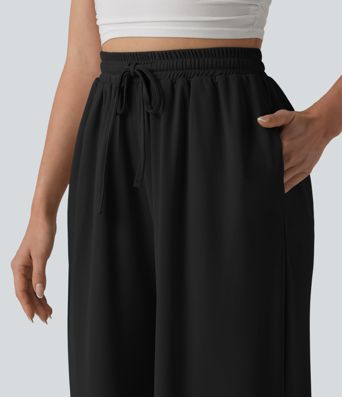 Baggy kalhoty s vysokým pasem, se šňůrkou a kapsami