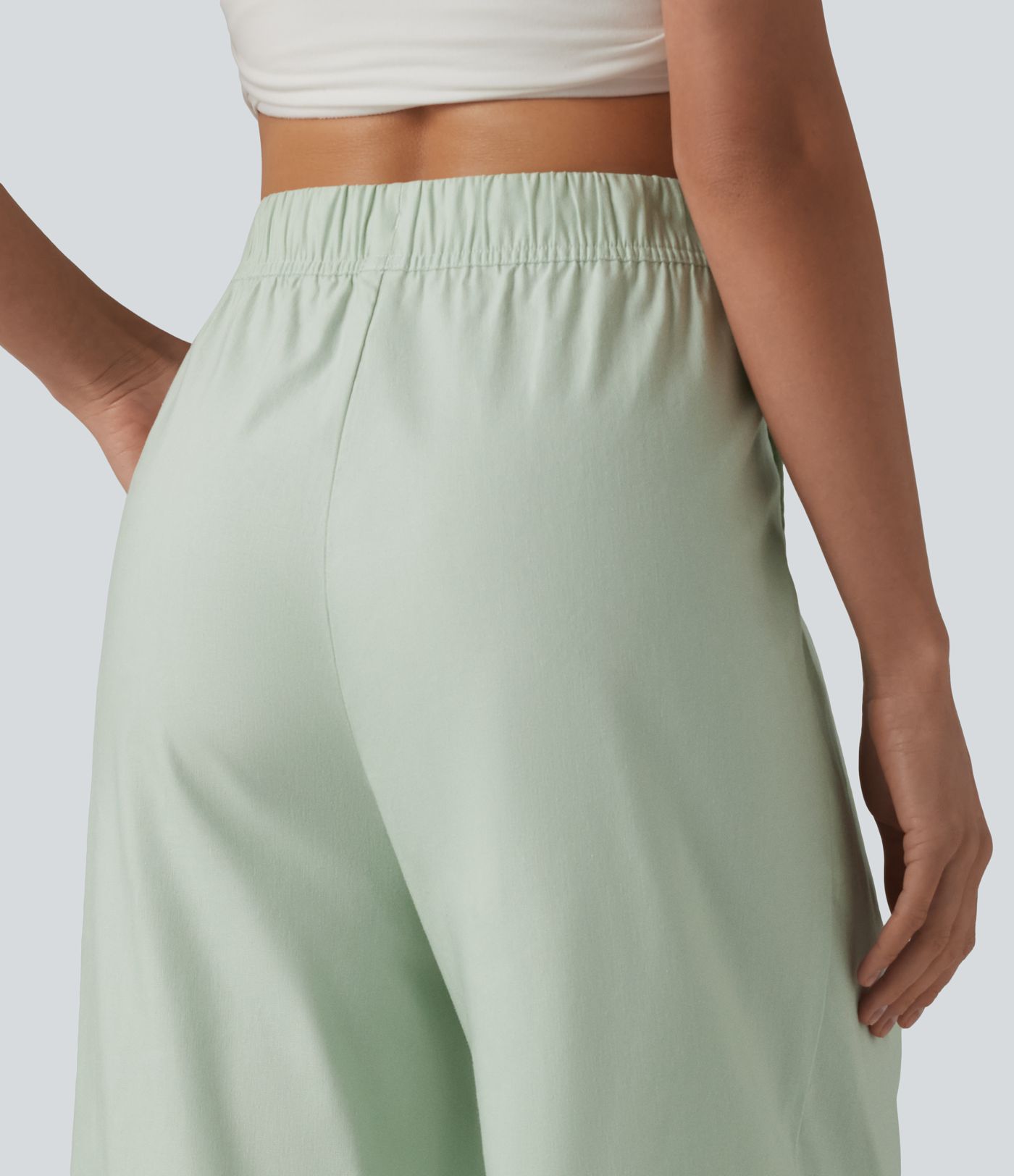 Pantalon casual court en coton et lin taille haute coupe ballon avec cordon de serrage et poches