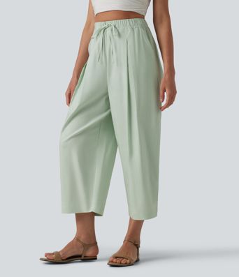 Pantalon casual court en coton et lin taille haute coupe ballon avec cordon de serrage et poches