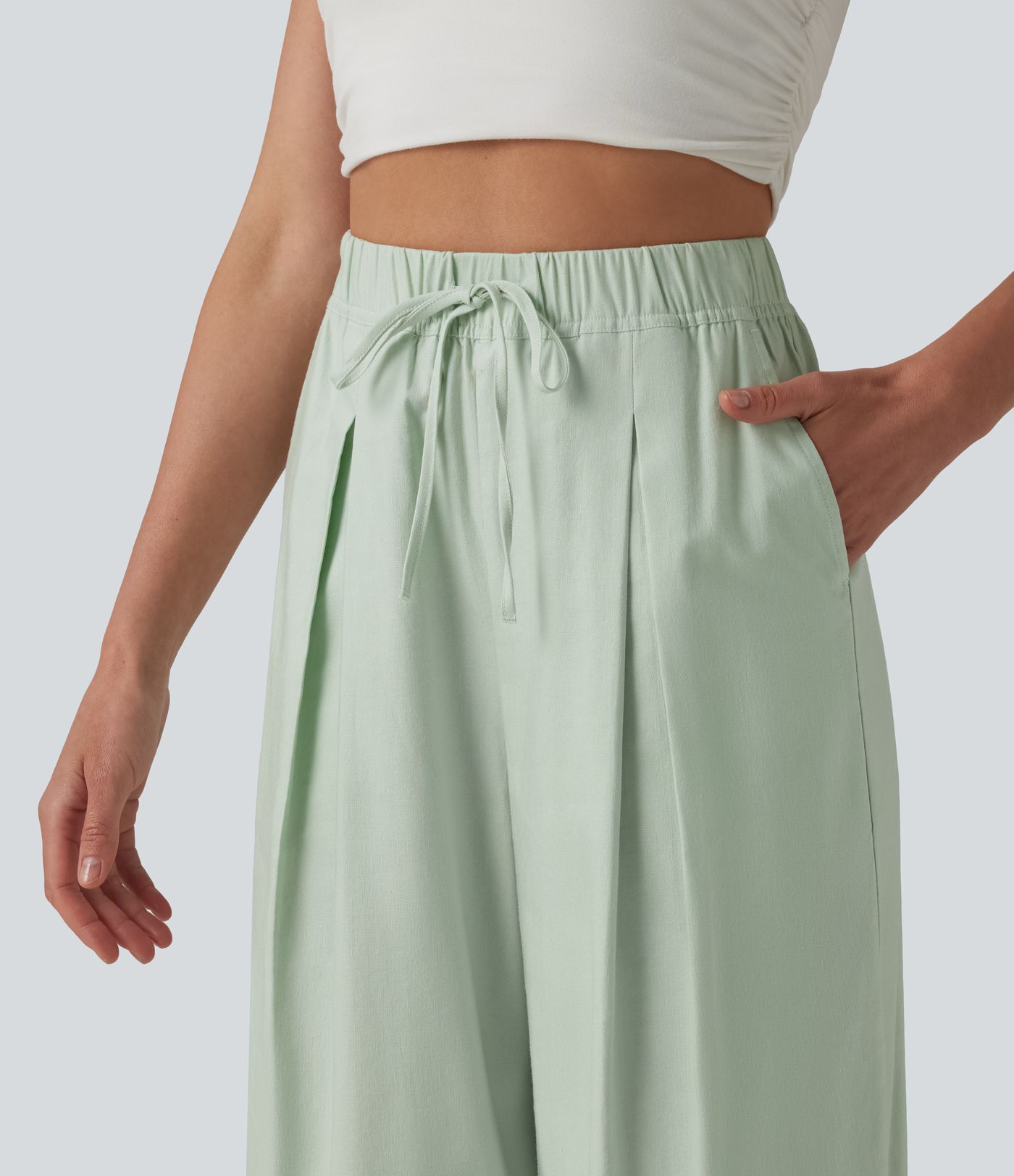 Pantalon casual court en coton et lin taille haute coupe ballon avec cordon de serrage et poches